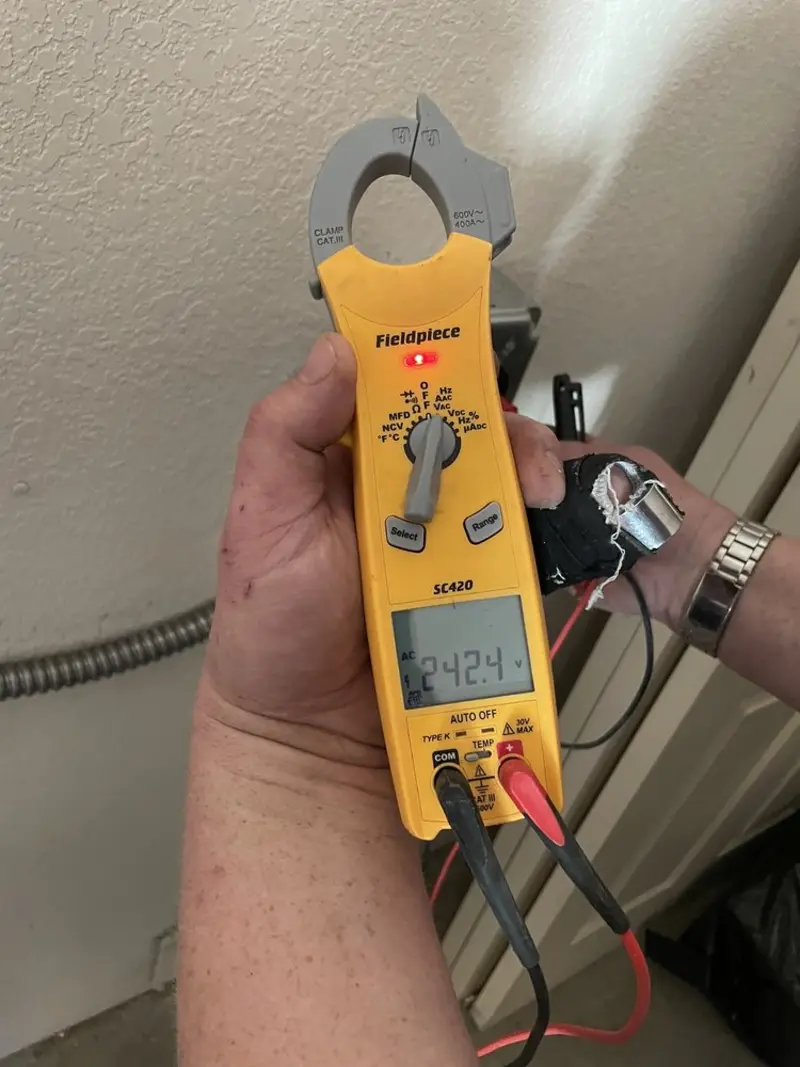 Voltage testing with clamp meter during Electrical Installation Services in East Hartford